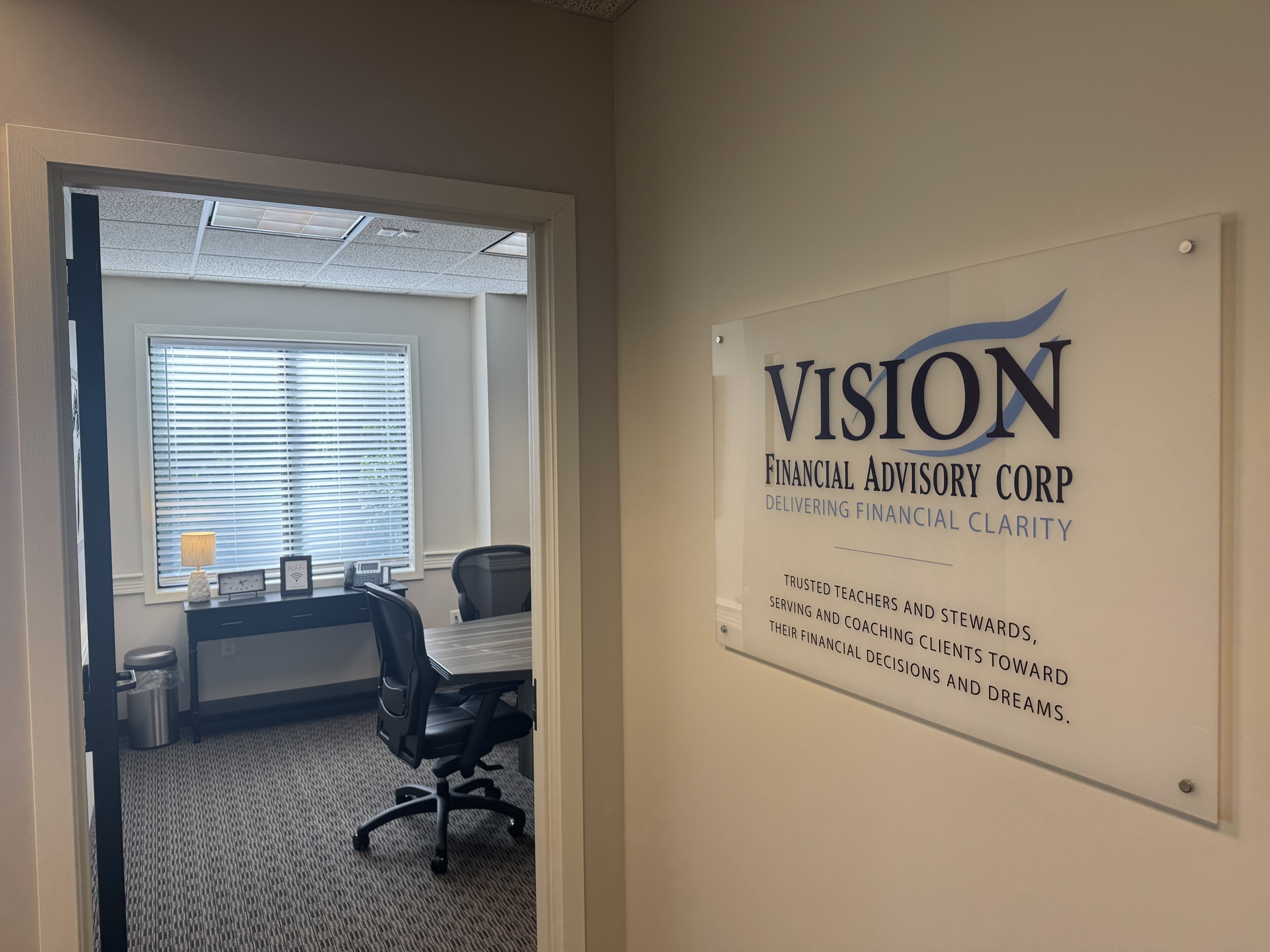 Plaque of Vision's purpose statement outside the door to a conference room.